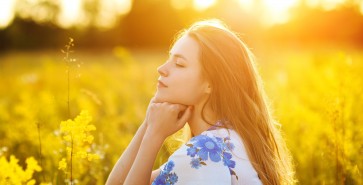 Beautiful girl on the flowers field Beautiful blonde woman in the flowers field on sunset  Healthy Lifestyle Soft focus